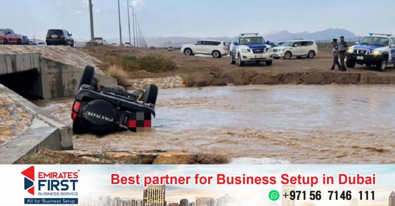 Motorist tries to film flooded wadi while driving, injures himself in crash