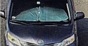 A driver in Sharjah drove a vehicle with a sunshade that obstructed visibility.